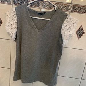 Light great short sleeve shirt with lacy sleeves. Never worn.